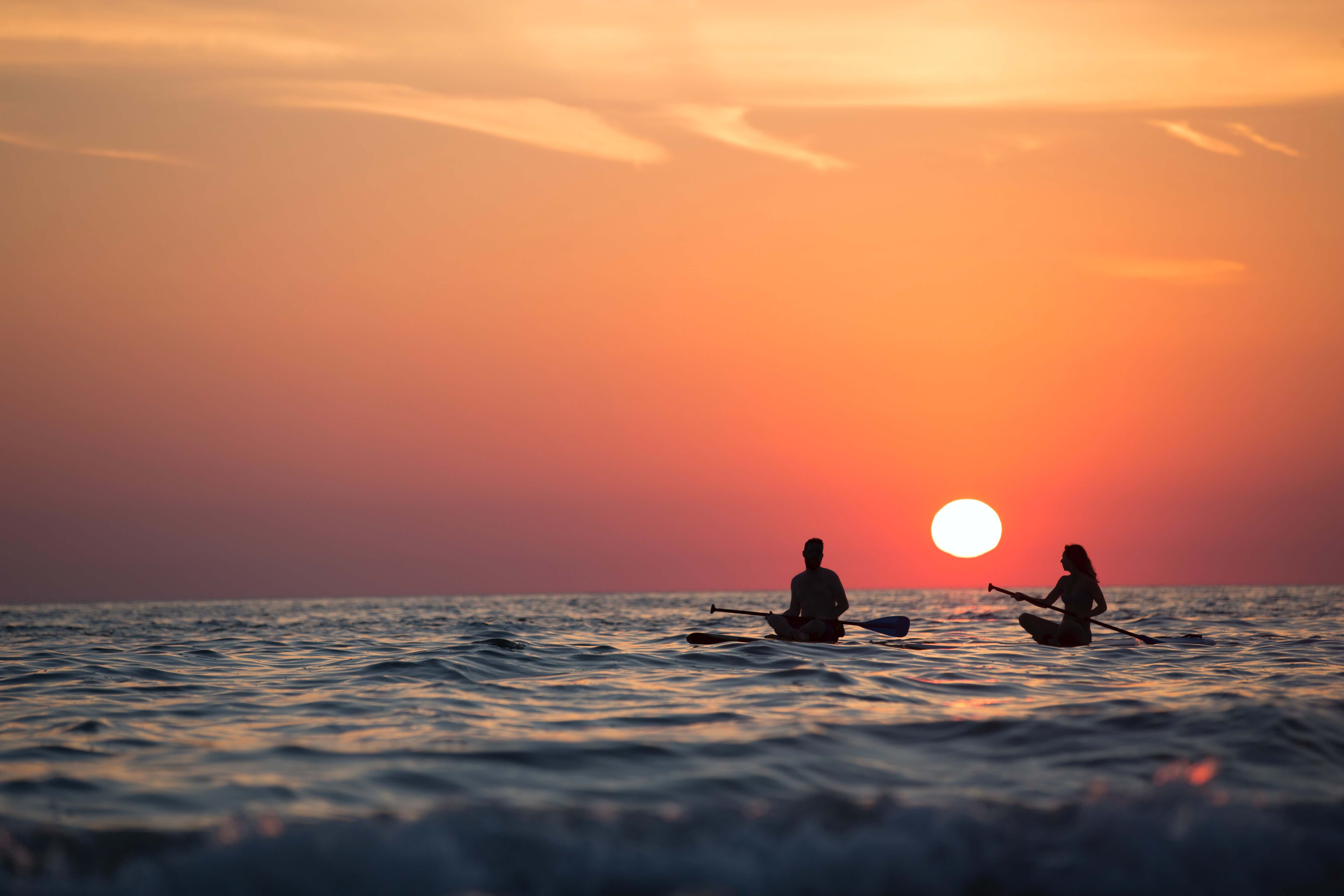 kayak kayaking during sunset on ocean sea